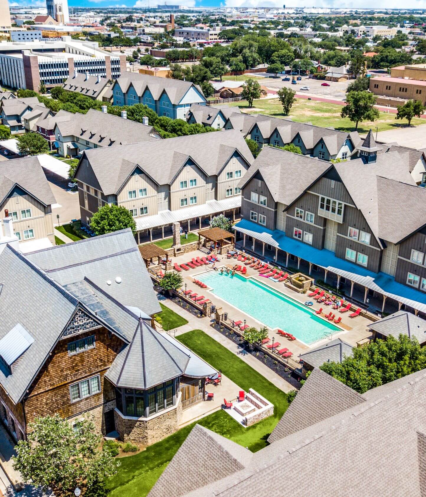 the collective at lubbock off campus cottage apartments near texas tech ttu aerial pool and cottage view